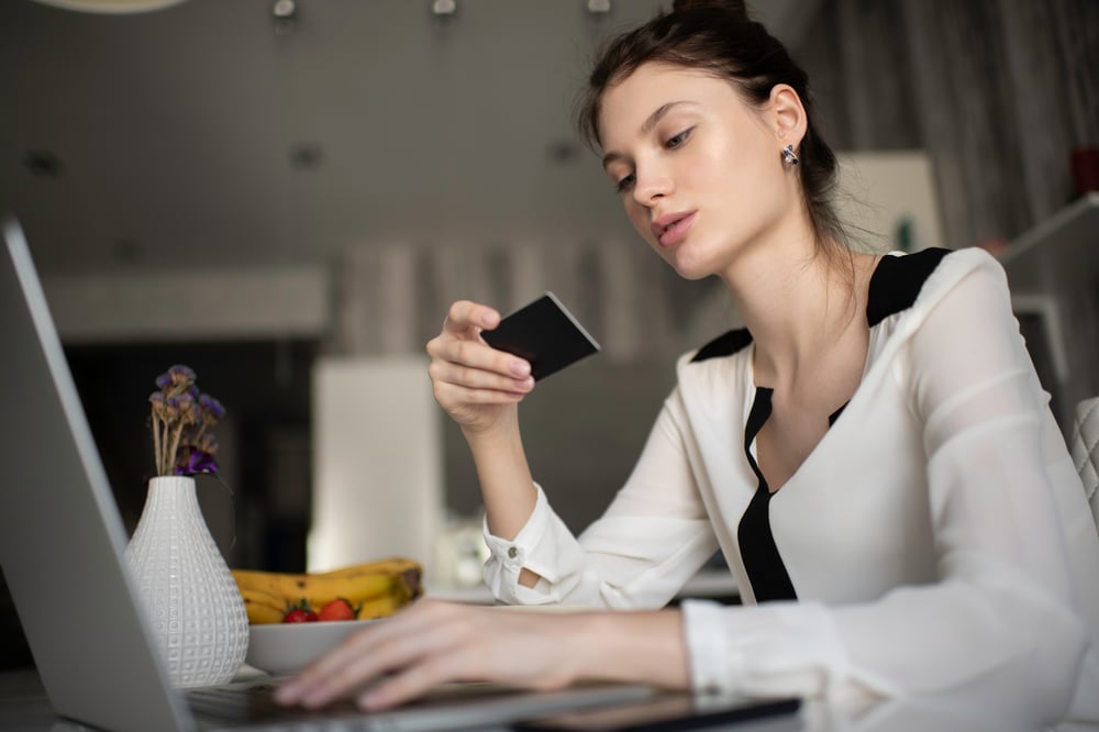 businesswoman-using-credit-card-for-shopping-onlin-66V25B6