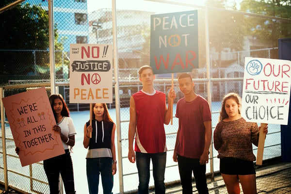 group-of-teenagers-protesting-demonstration-holdin-1920