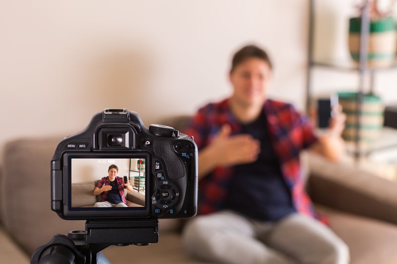 vlogger-recording-social-media-video-while-sitting-A4NLQ3U