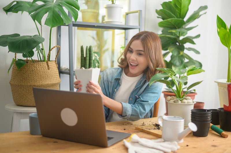 young-woman-entrepreneur-working-with-laptop-prese-2021-05-21-17-25-43-utc
