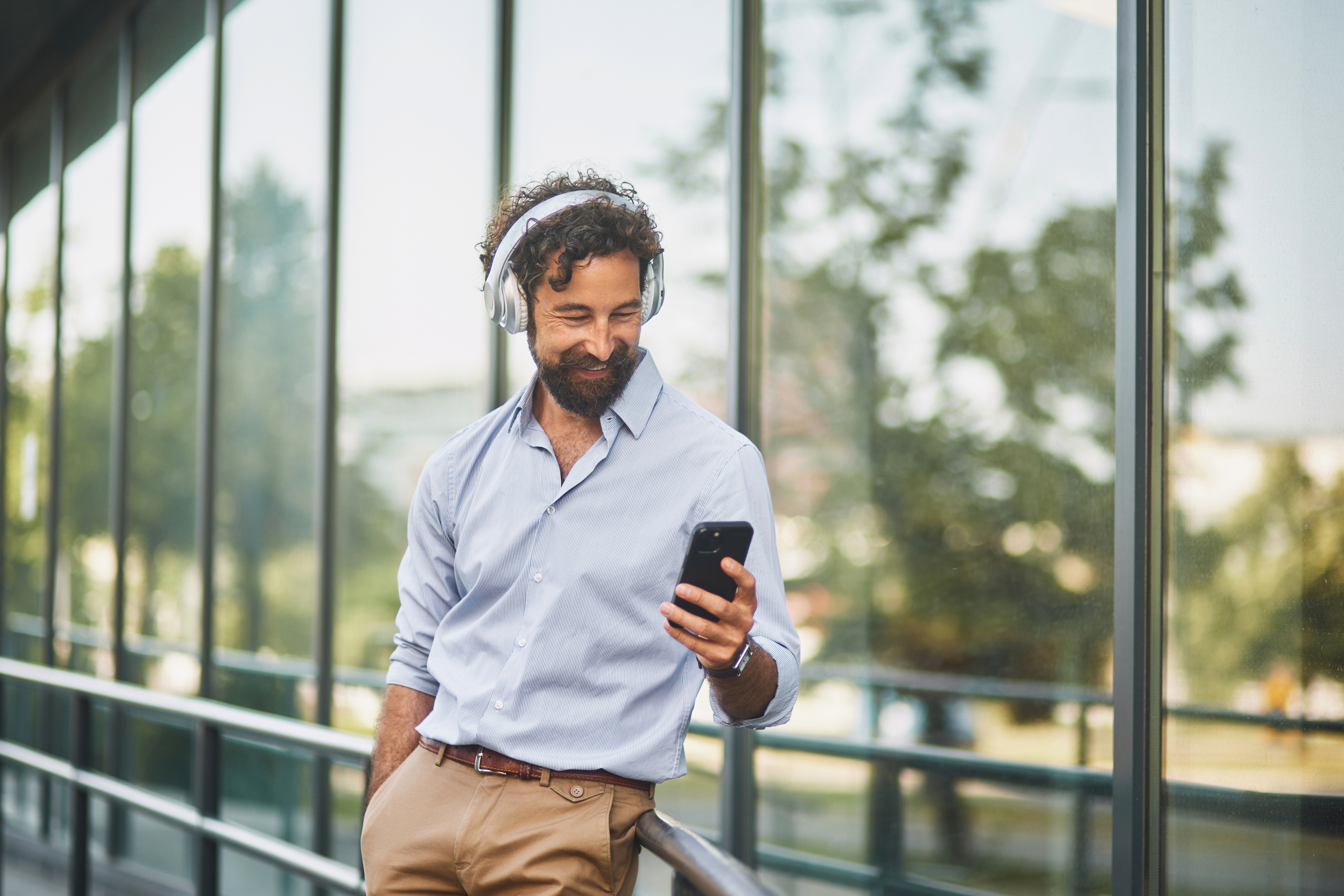Sales rep reviewing AI-recommended follow-up tasks on his smartphone